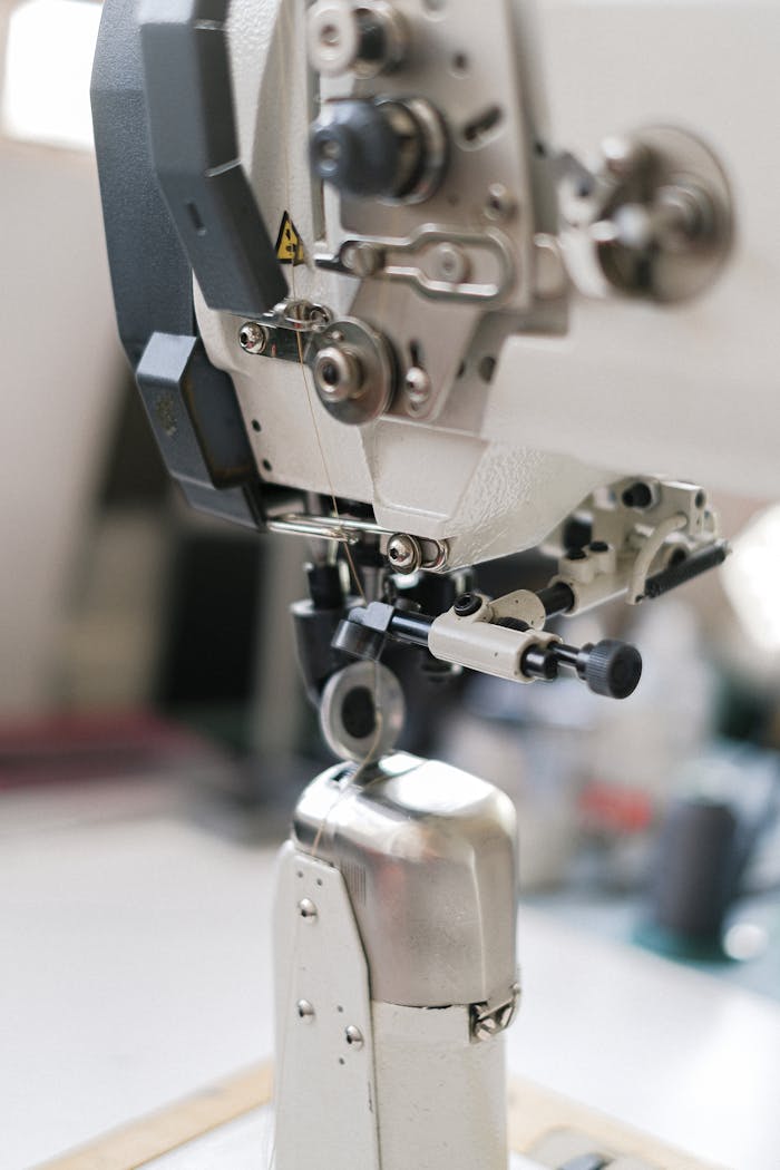 Detailed view of sewing machine components, showcasing precision and industrial design.